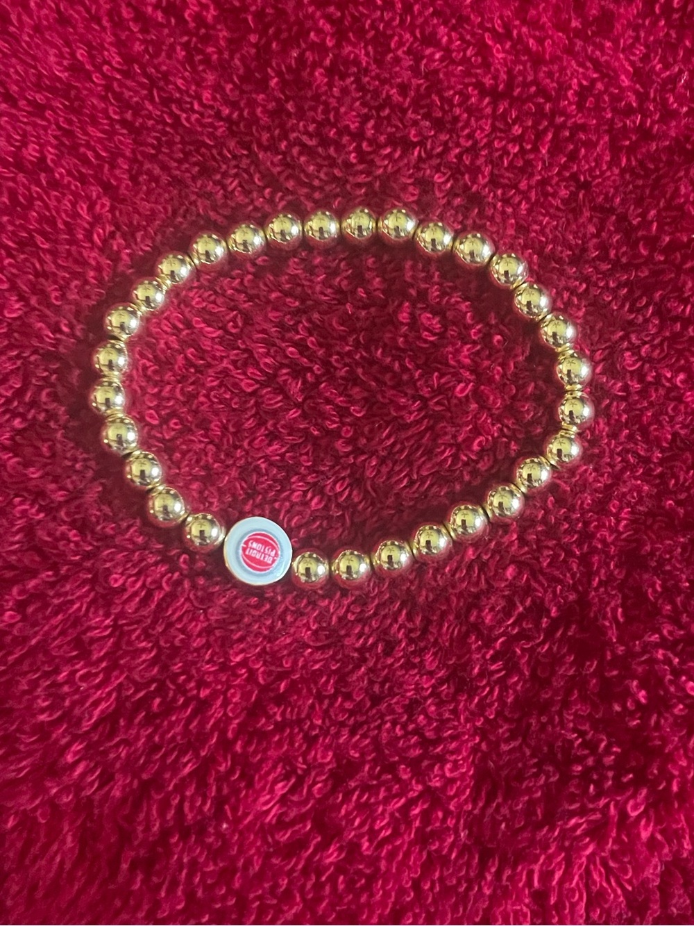 BaubleBar Detroit Pistons Logo gold bead stretch bracelet